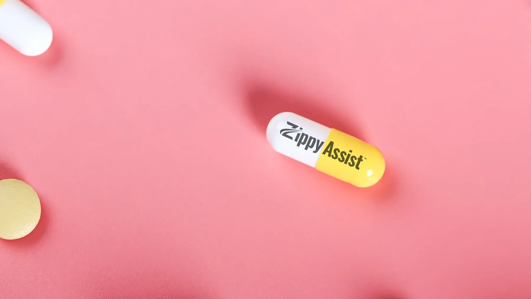 A painkiller capsule with the words "ZippyAssist" sits on a pink background, with other tablets and pills.